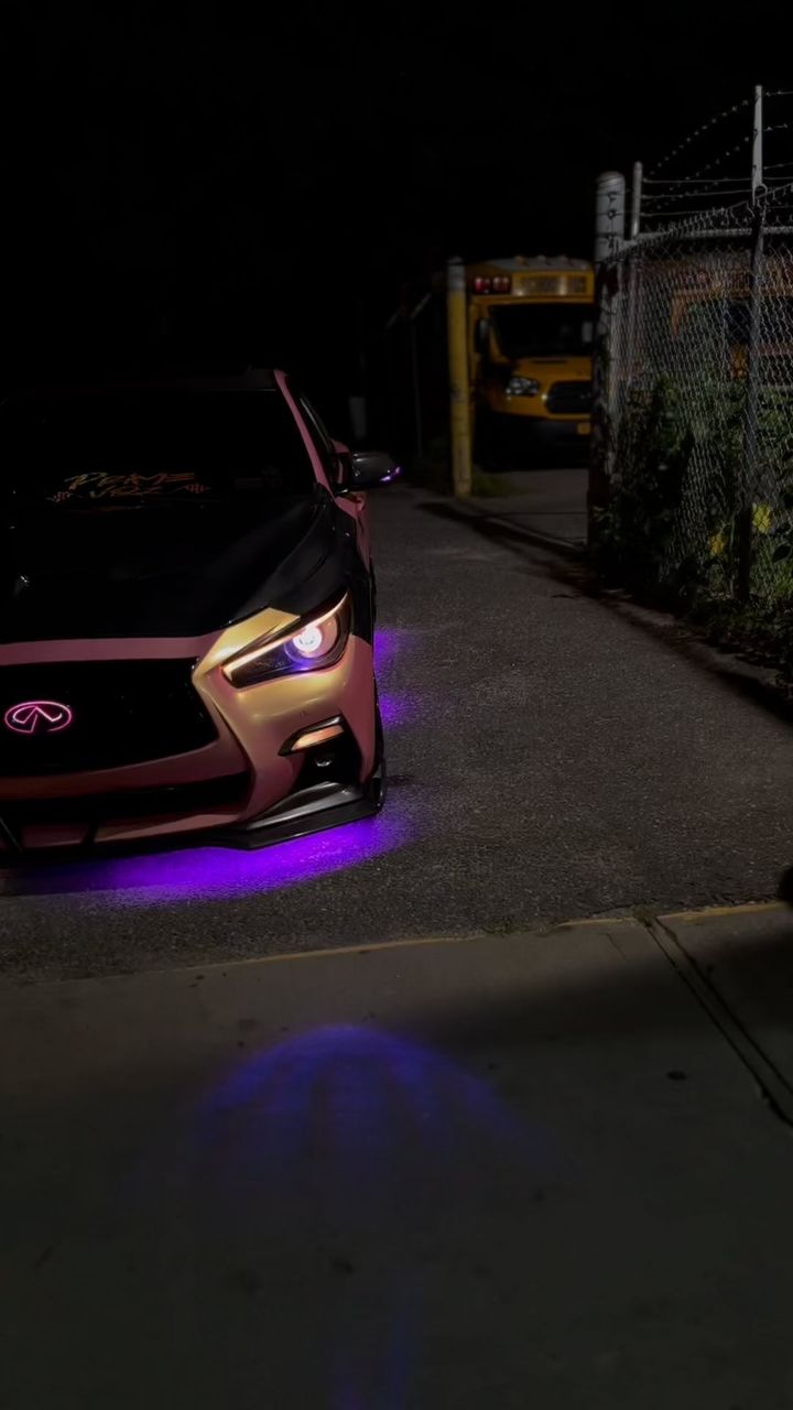 Infiniti Q50 at night with two-tone underglow