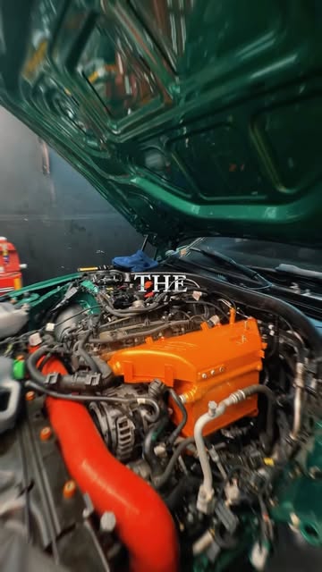 BMW engine bay with orange powder-coated parts